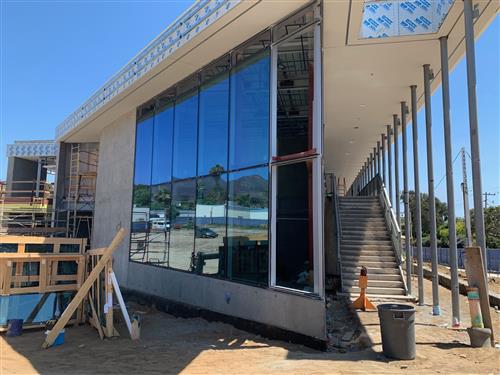 The floor-to-ceiling glass on the new building gives a view of the Pacific Ocean. 