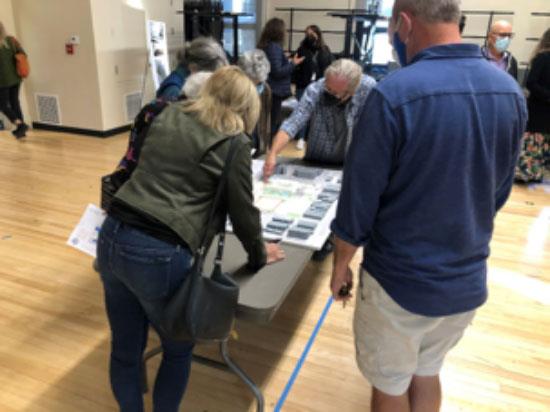 People looking over plans for McKinley Elementary School updates
