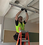 Worker installing LED lighting 