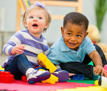 two toddlers playing together